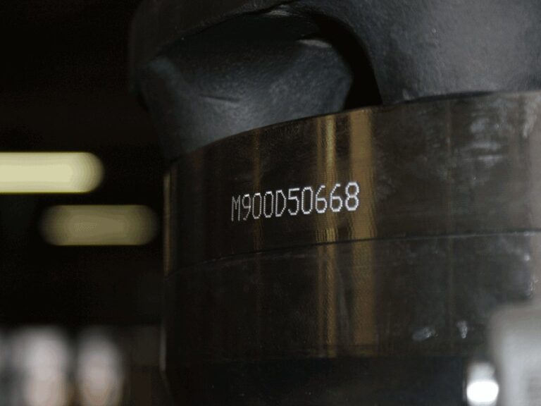 Dot peen serial number on cast housing