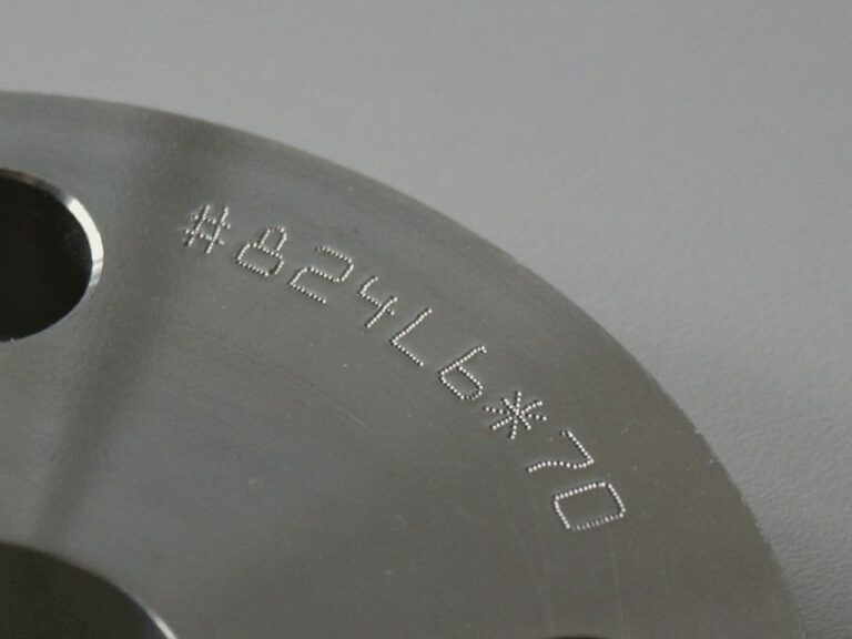 Dot peen serial number on flange