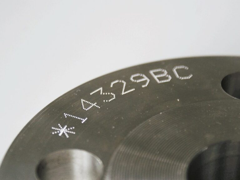 Dot peen serial number on flange face