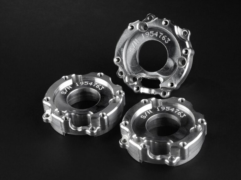 Dot peen serial numbers on machined rings